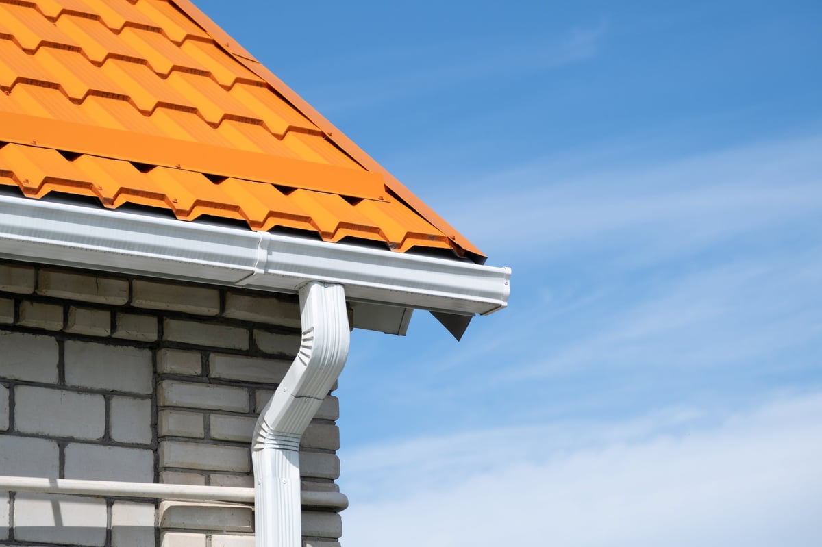 Rain gutter pipeline system on brick house